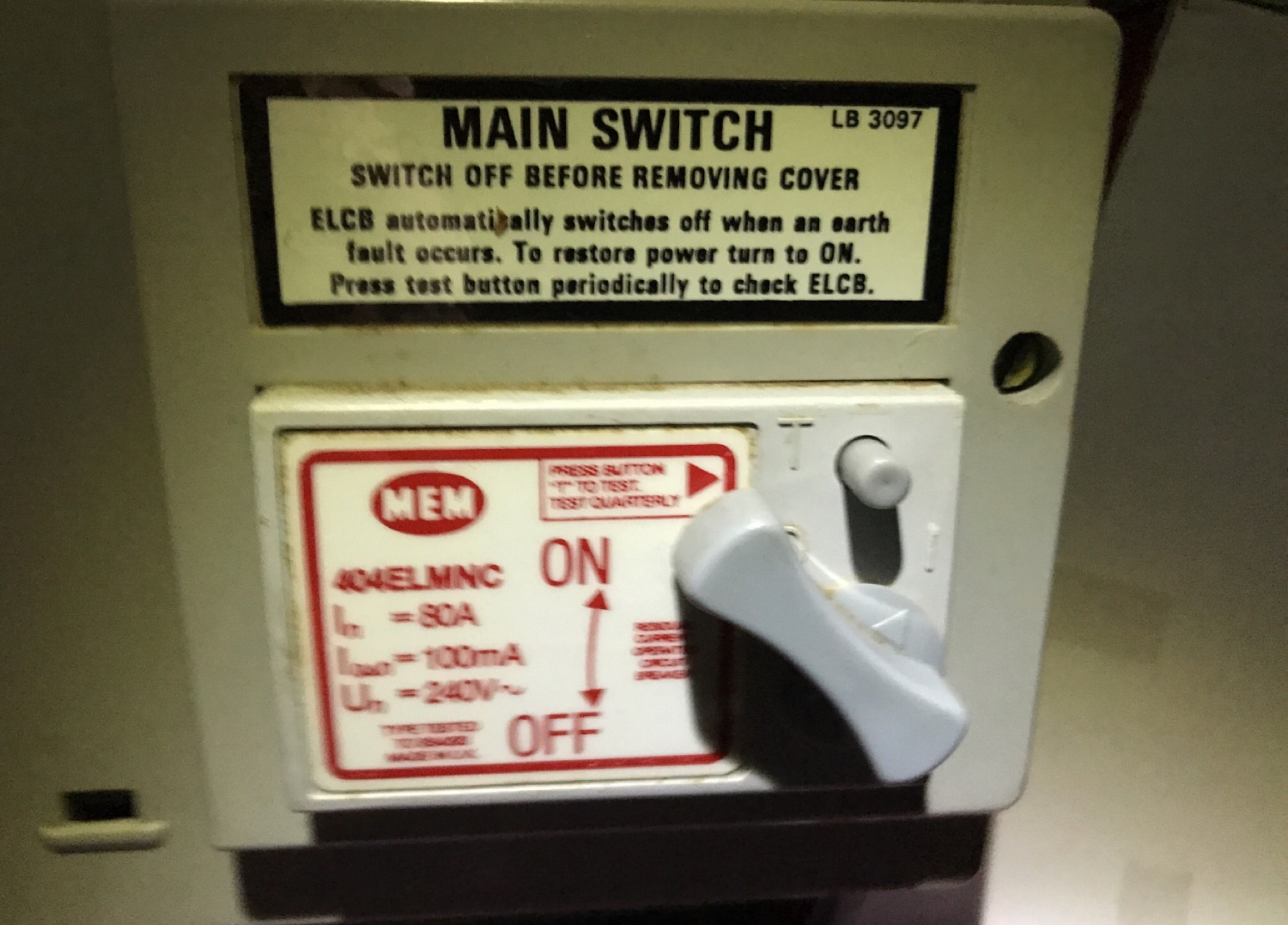 An original MEM voltage-operated ELCB still in service — the sort of ageing protection an inspection flags for replacement.